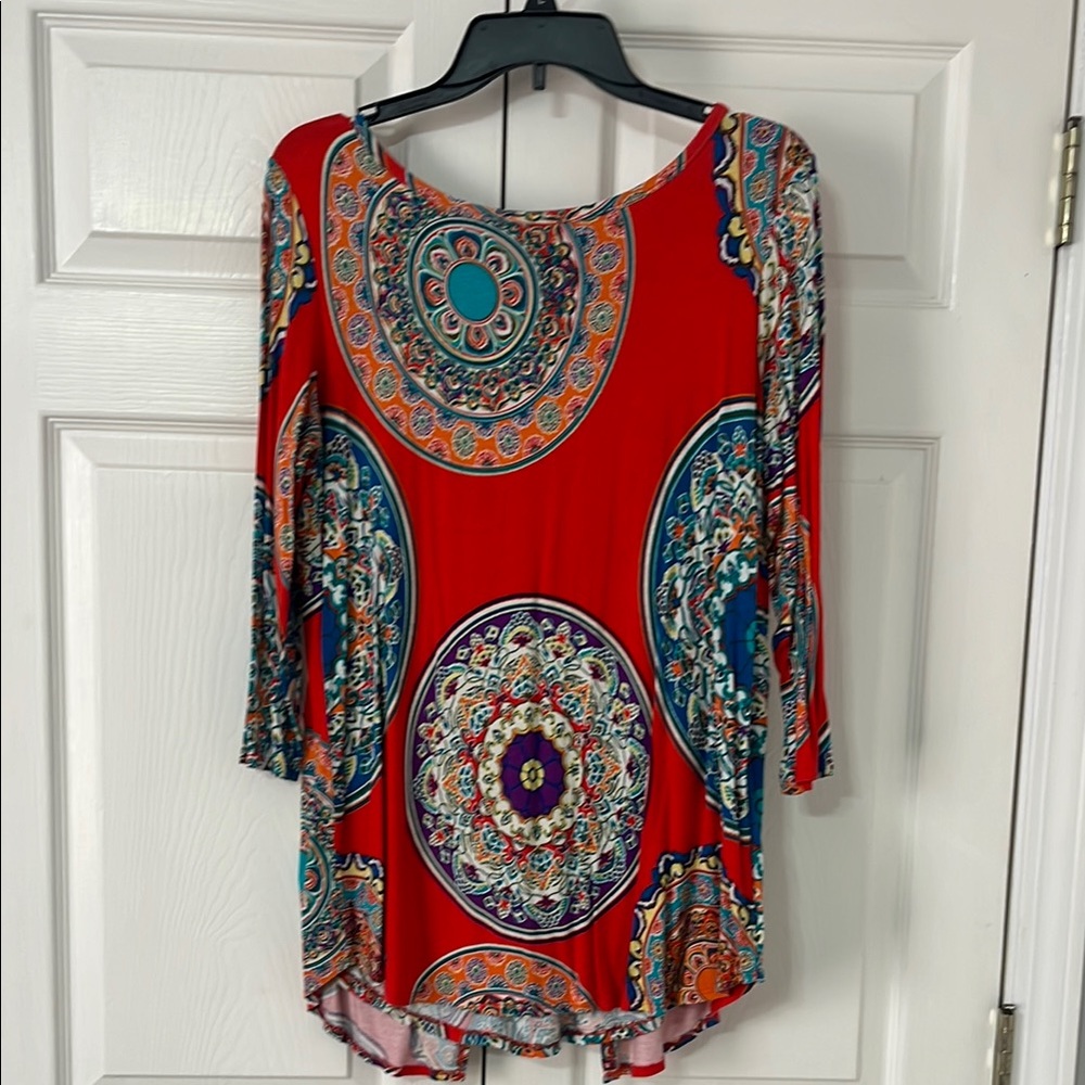 Women's Red/ Dark Orange Patterned Top. The back splits open in a way. See pic.